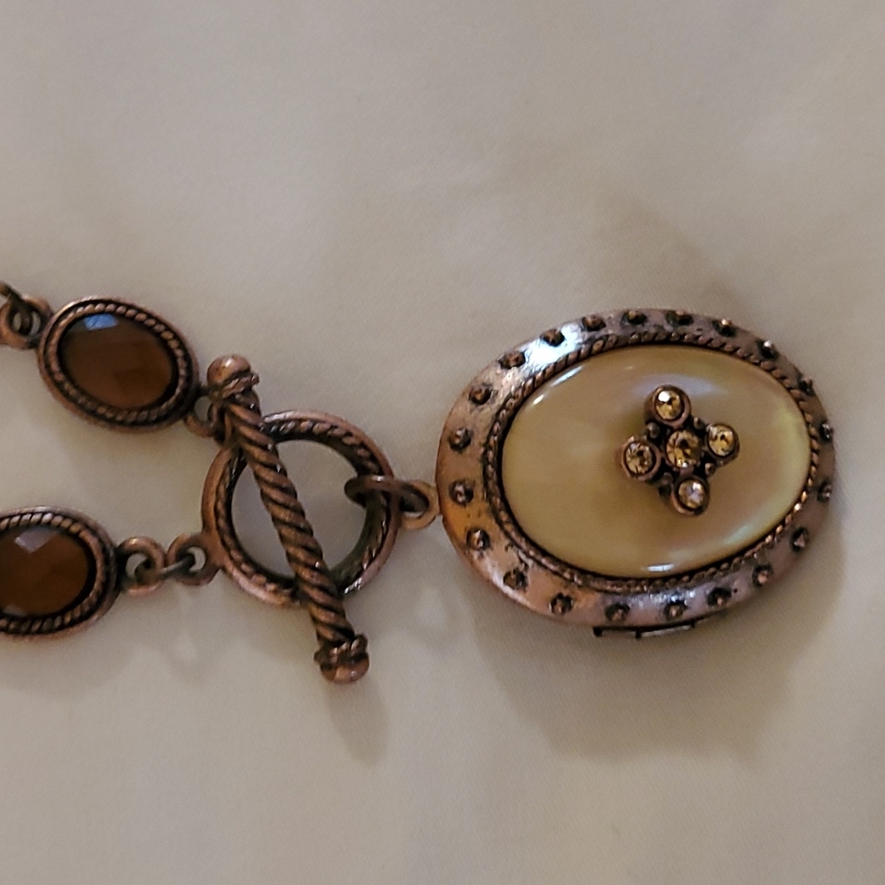 Costume jewelry- locket with pearl inlay and rhinestones. Rope chain 14.5 inches